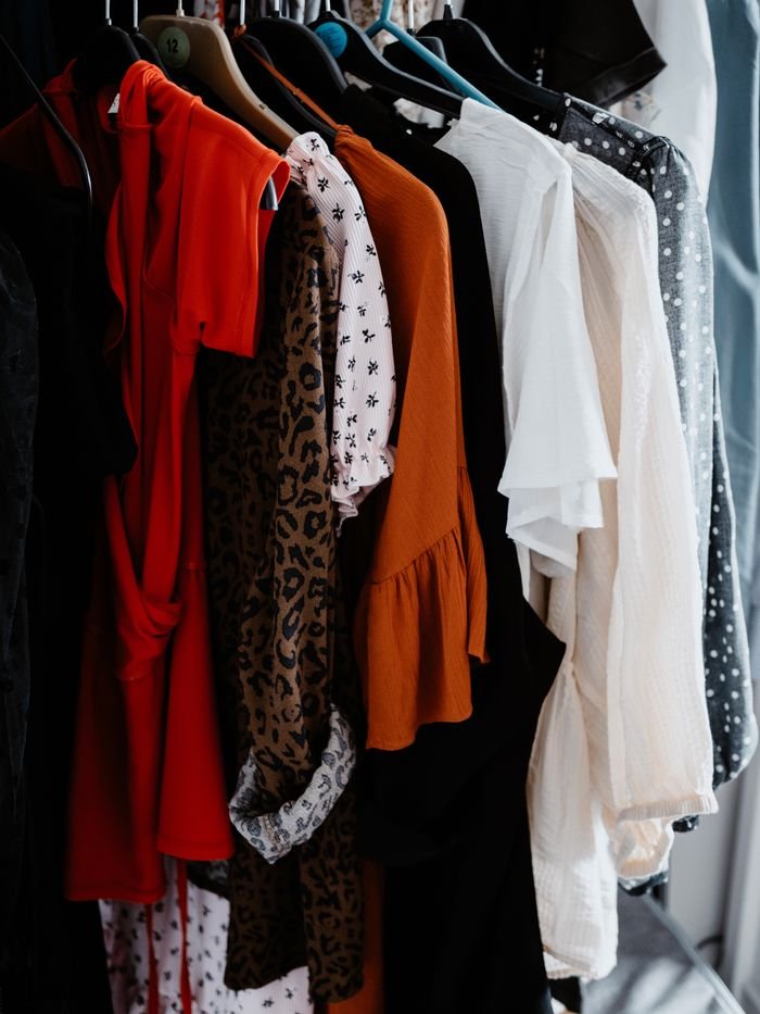 The Art of Drawing Readers In: Your attractive post title goes here A diverse collection of colorful clothing on hangers showcasing a range of fashion styles.
